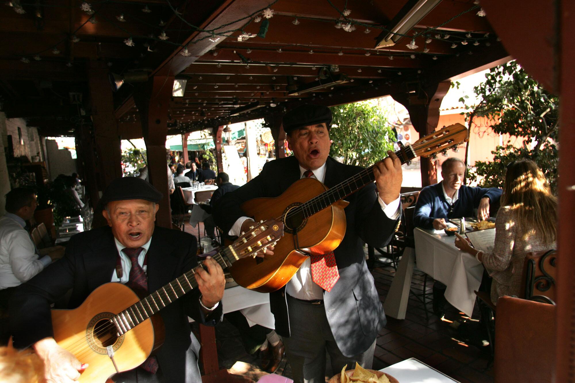 A mariachi singing for patrons of La Golondrina Cafe on Olvera Street in 2023.