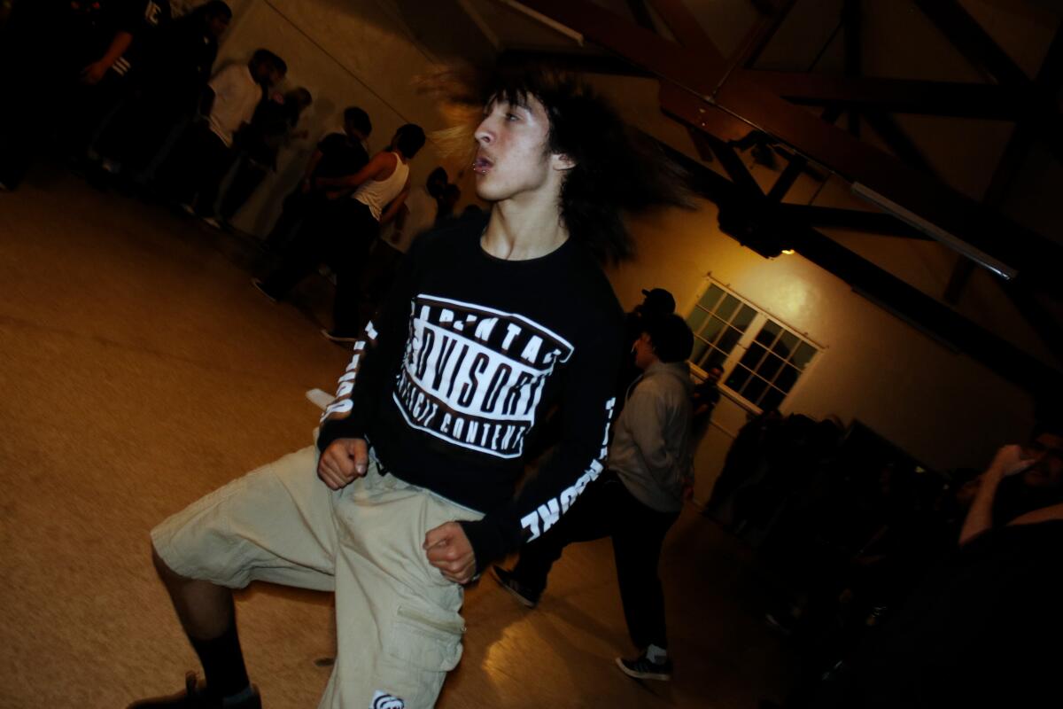 Andres Rodriguez, 18, moshes during Marked for Death's performance on April 3, 2026, in St. John's Episcopal Church in San Bernardino.