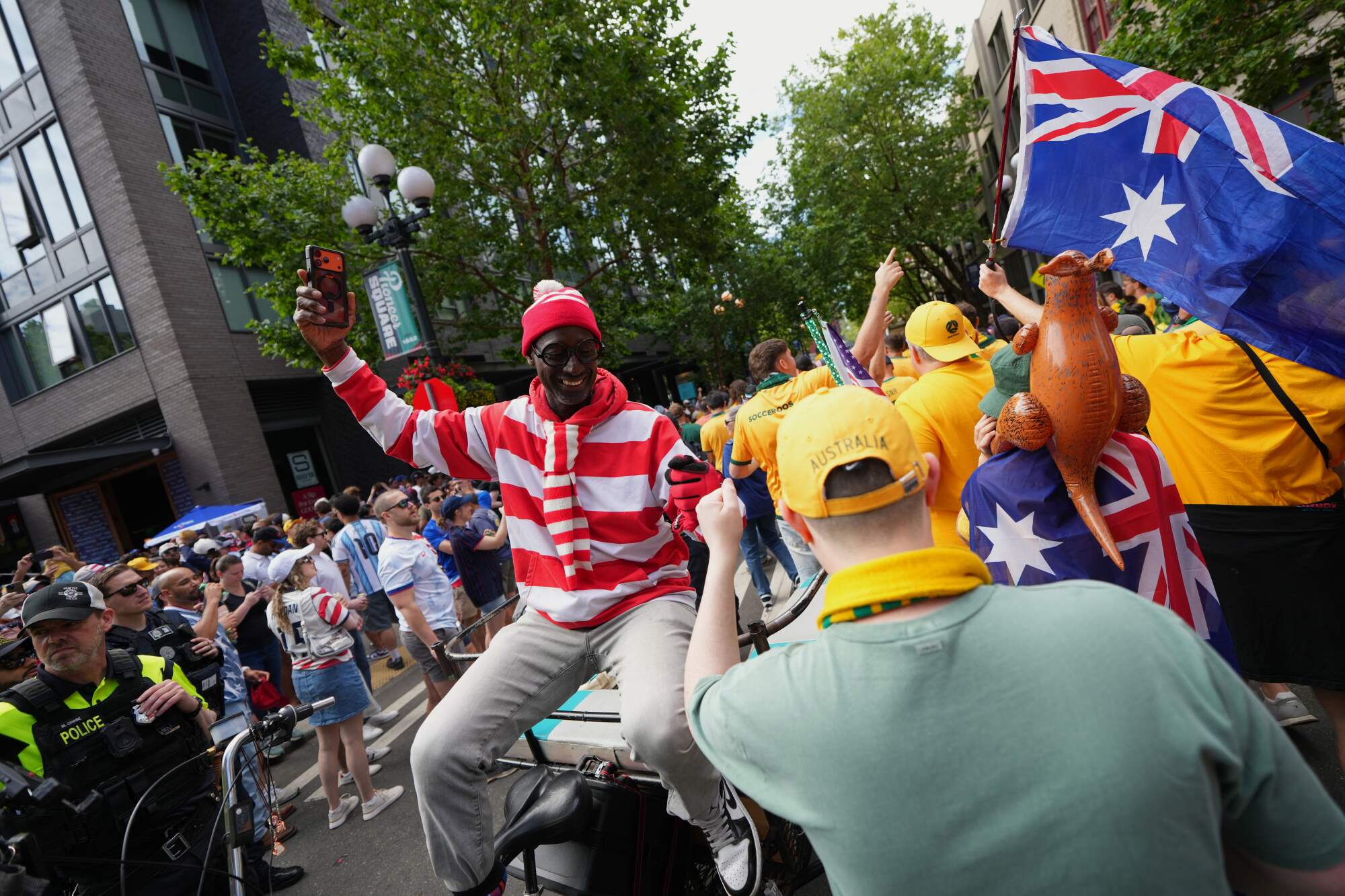 U.S. and Australia fans bump fists on their way to the stadium before their game in Seattle on June 19, 2026.
