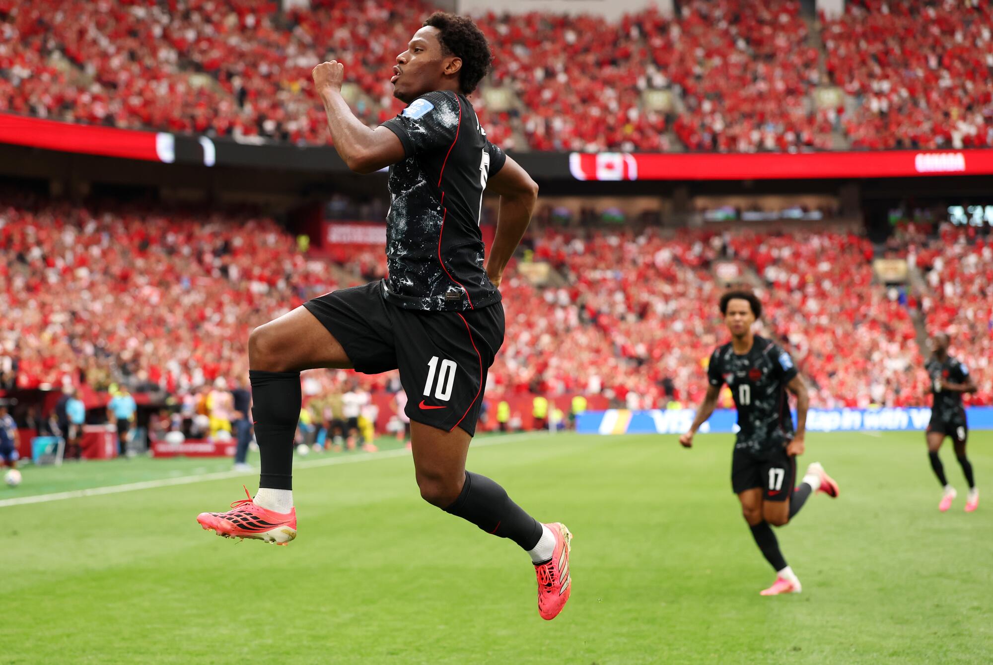 Canada's Jonathan David celebrates after scoring against Qatar on June 18.