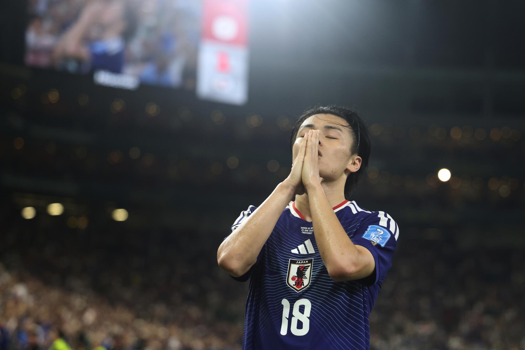 Japan's Ayase Ueda celebrates after scoring against Tunisia on June 20.