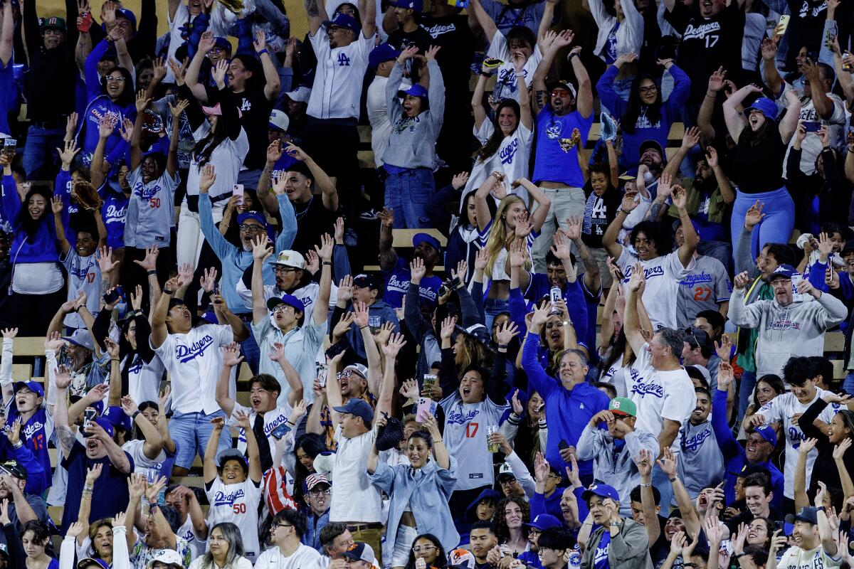 Dodger fans do the wave.