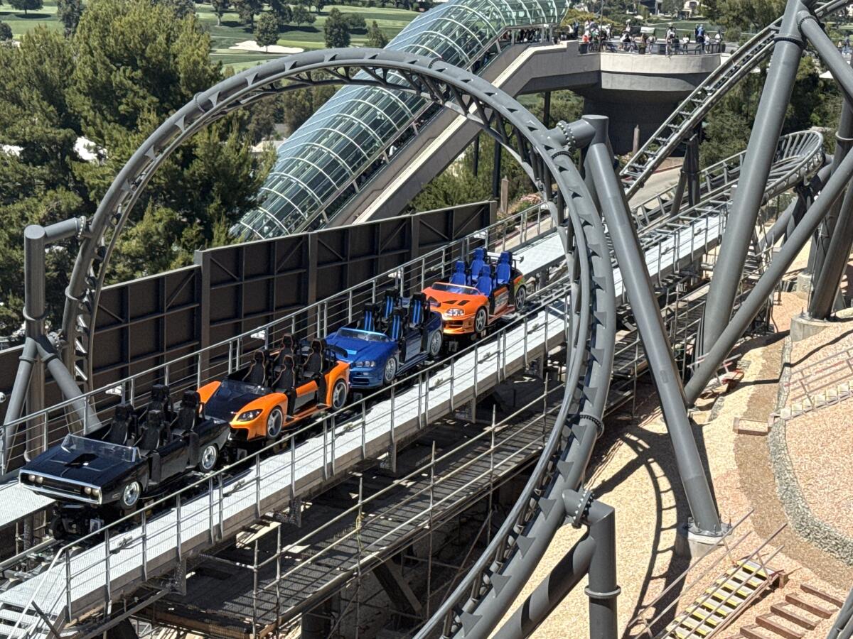 Coaster car vehicles on a track.