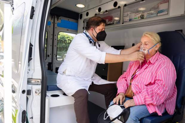 From left, Dr. Demetrio Cardenas provides Asuncion Palacios, who suffers from asthma, with Albuterol during an event for residents affected by the Boyle Heights warehouse fire at Our Lady of Victory Catholic Church in Los Angeles on Tuesday, June 23, 2026. (Photo by Drew A. Kelley, Press-Telegram/SCNG)