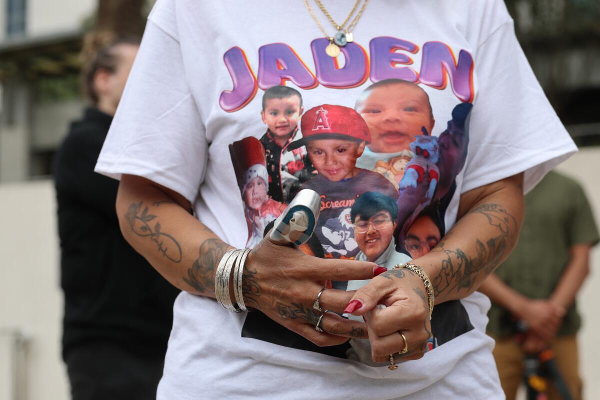 Maribel Michaca, mother of Jaden Michaca, who was fatally shot by Santa Ana Police, shows her thumb that was also shot 