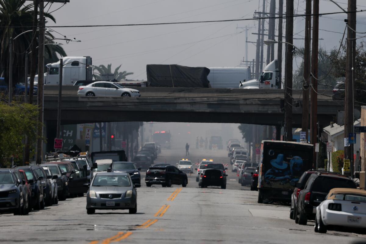The streets near the Lineage cold storage warehouse fire are shrouded in smoke on Monday.