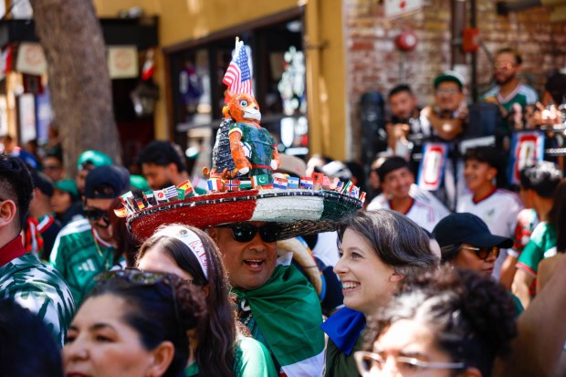 Fans of Mexico watch the World Cup from the parking structure at San Pedro Square Market in San Jose, Calif., on Thursday, June 11, 2026. (Shae Hammond/Bay Area News Group)