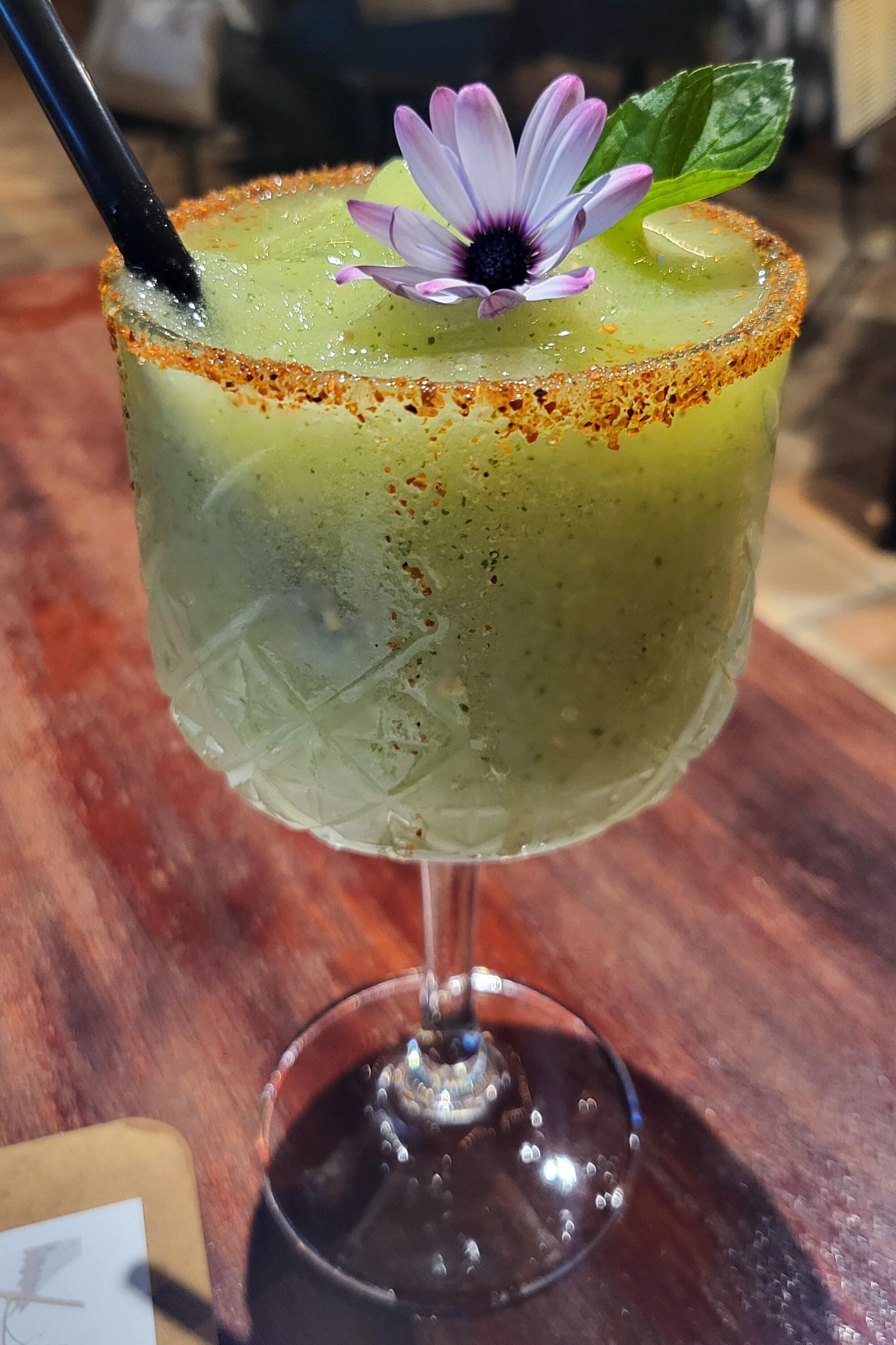 A cucumber and mezcal cocktail at a rooftop bar overlooking Colima's central square.