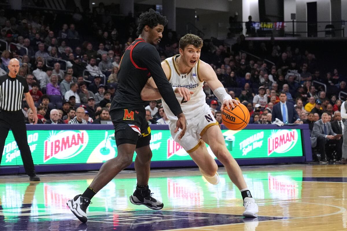 Nick Martinelli drives against Maryland forward Solomon Washington during a game last season.