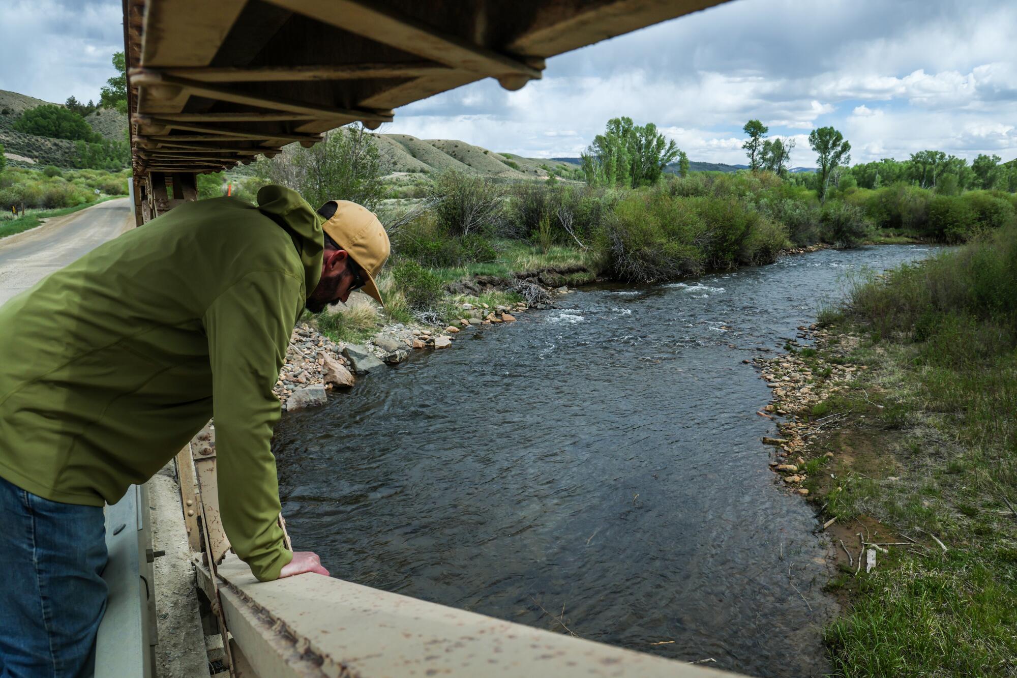 Rancher Doug Bruchez peers down at the Williams Fork River.