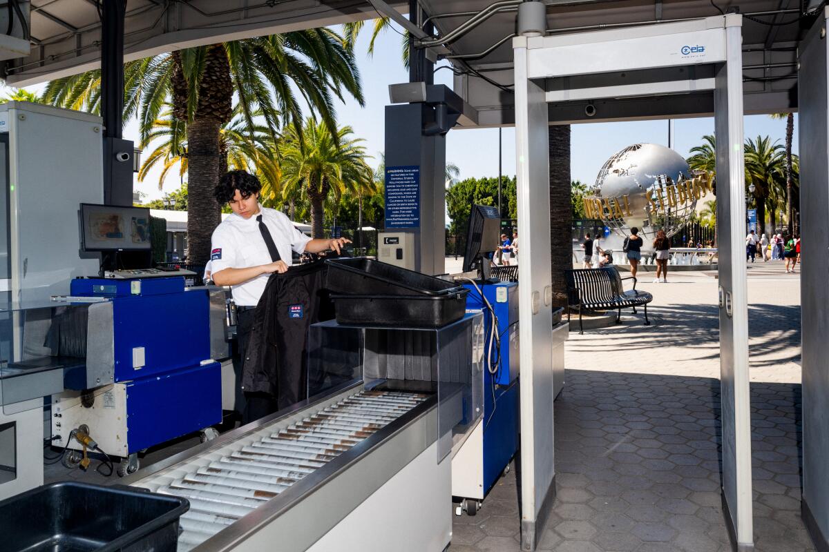 The Universal Studios globe is seen on the opposite side of the new security checkpoint outside Universal CityWalk Hollywood.