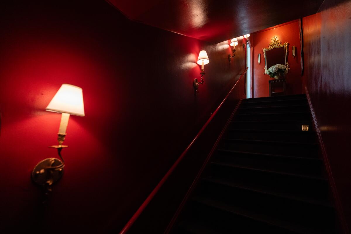 Julio Miranda-Martin's apartment decor starts in the bold staircase that leads to his door.