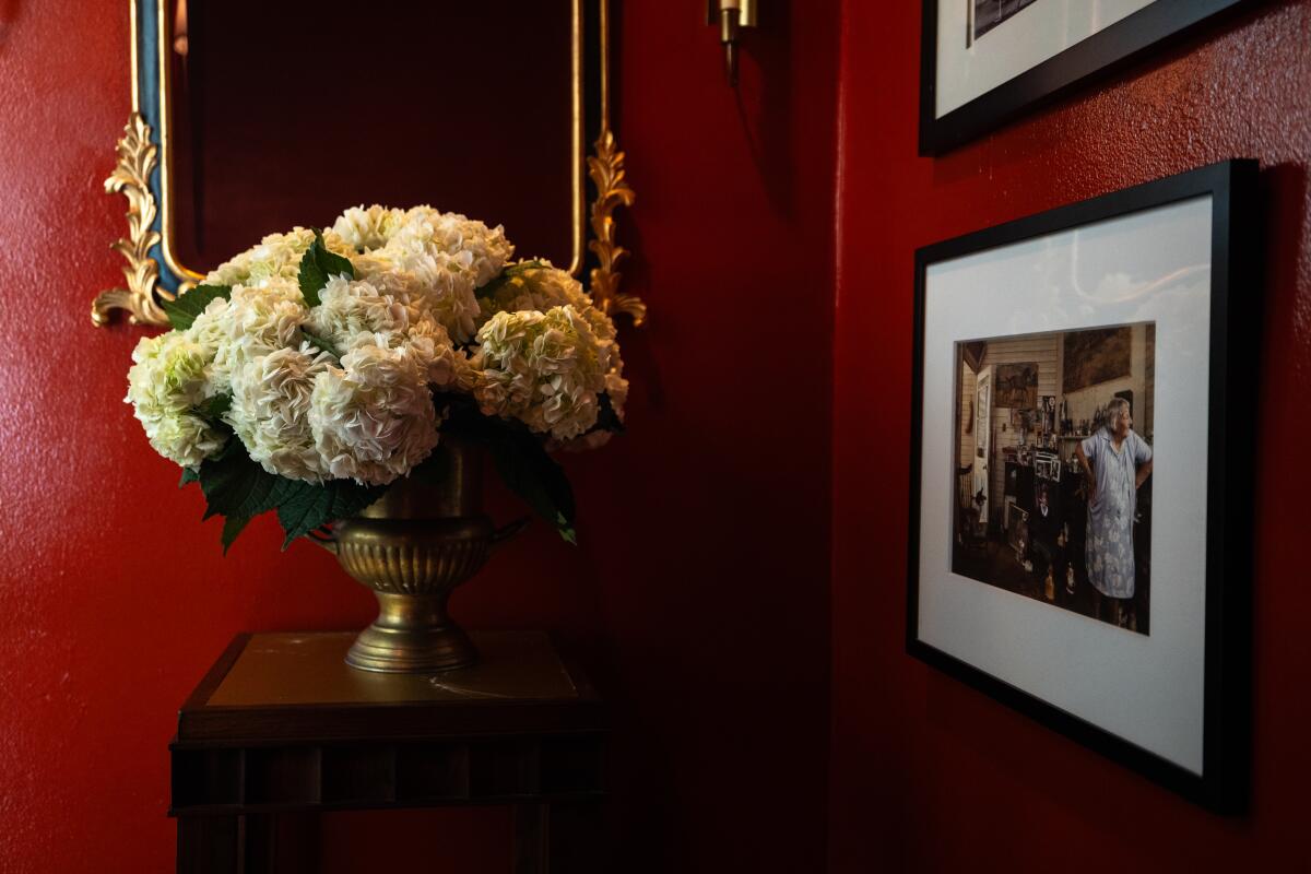 A mirror at the top of the staircase offers extra depth.