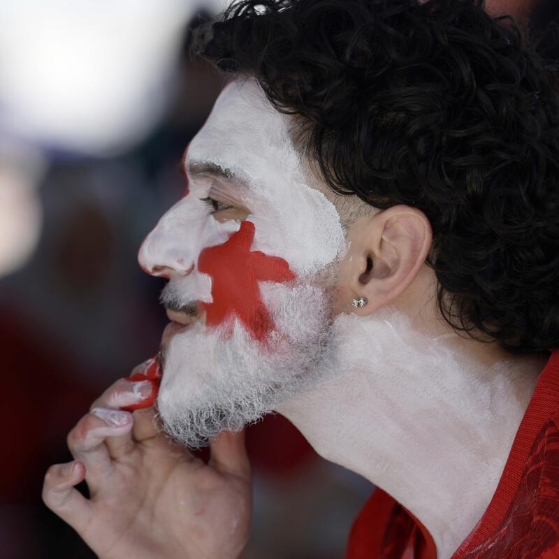 Emre Elmas of San Francisco, CA paints his face