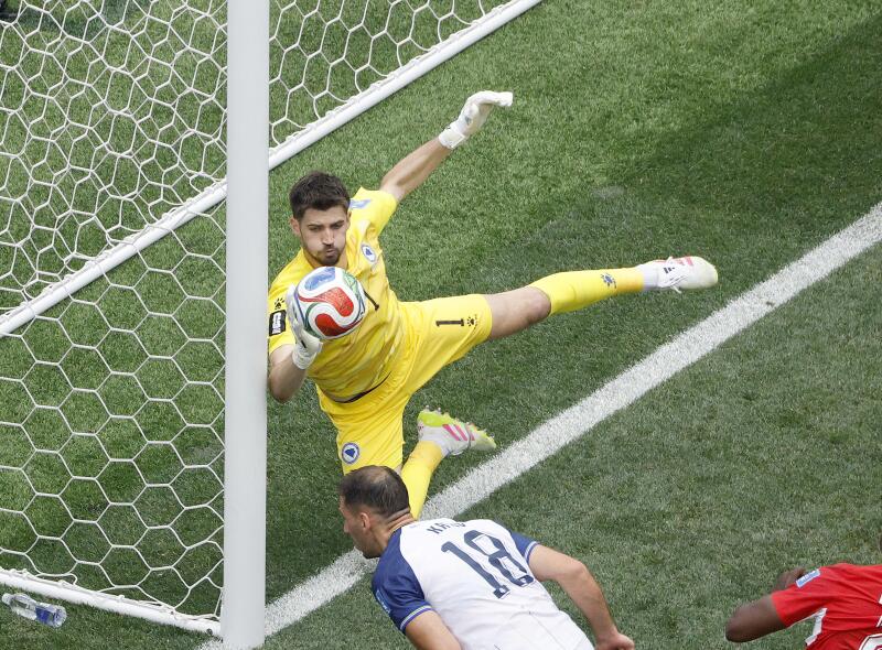 Bosnia and Herzegovina goalkeeper Nikola Vasilj (1) makes a save