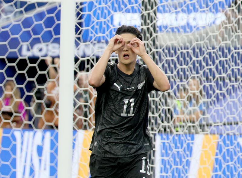 New Zealand forward Elijah Just reacts after scoring.