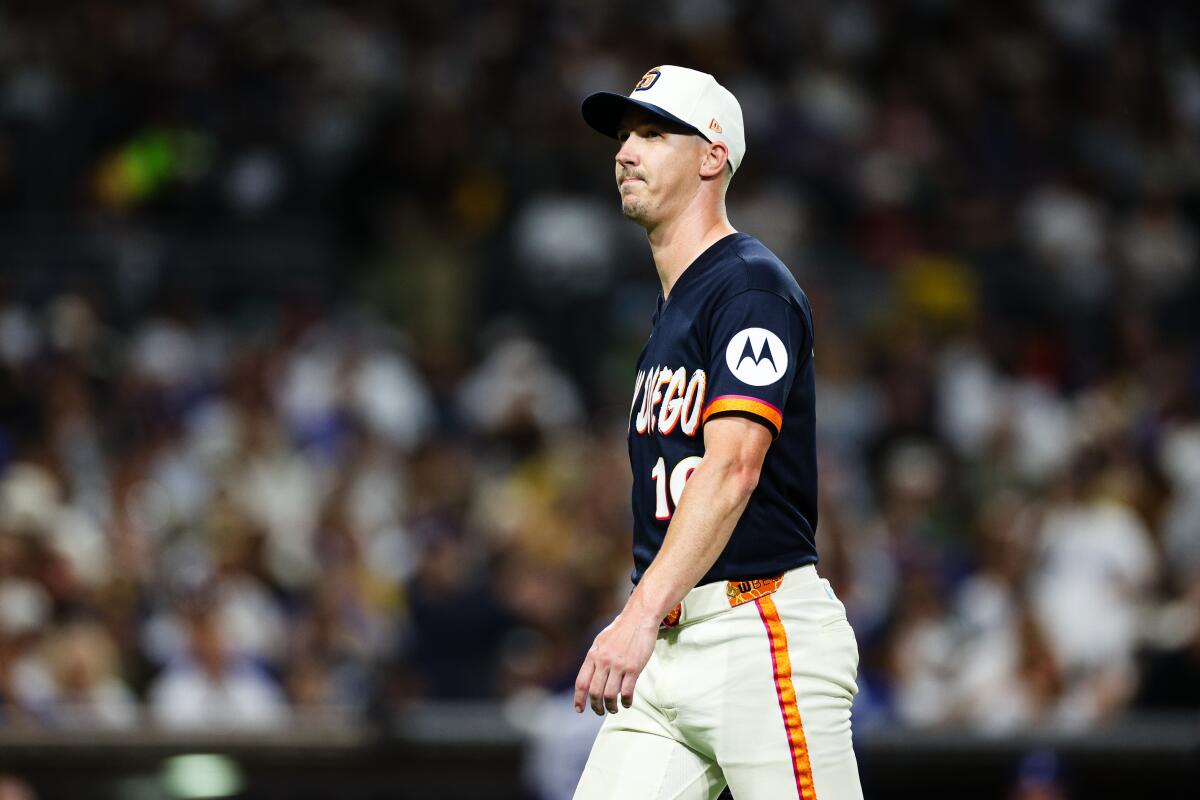 The Padres' Walker Buehler looks on after being relieved in the sixth inning against the Dodgers on Friday at Petco Park