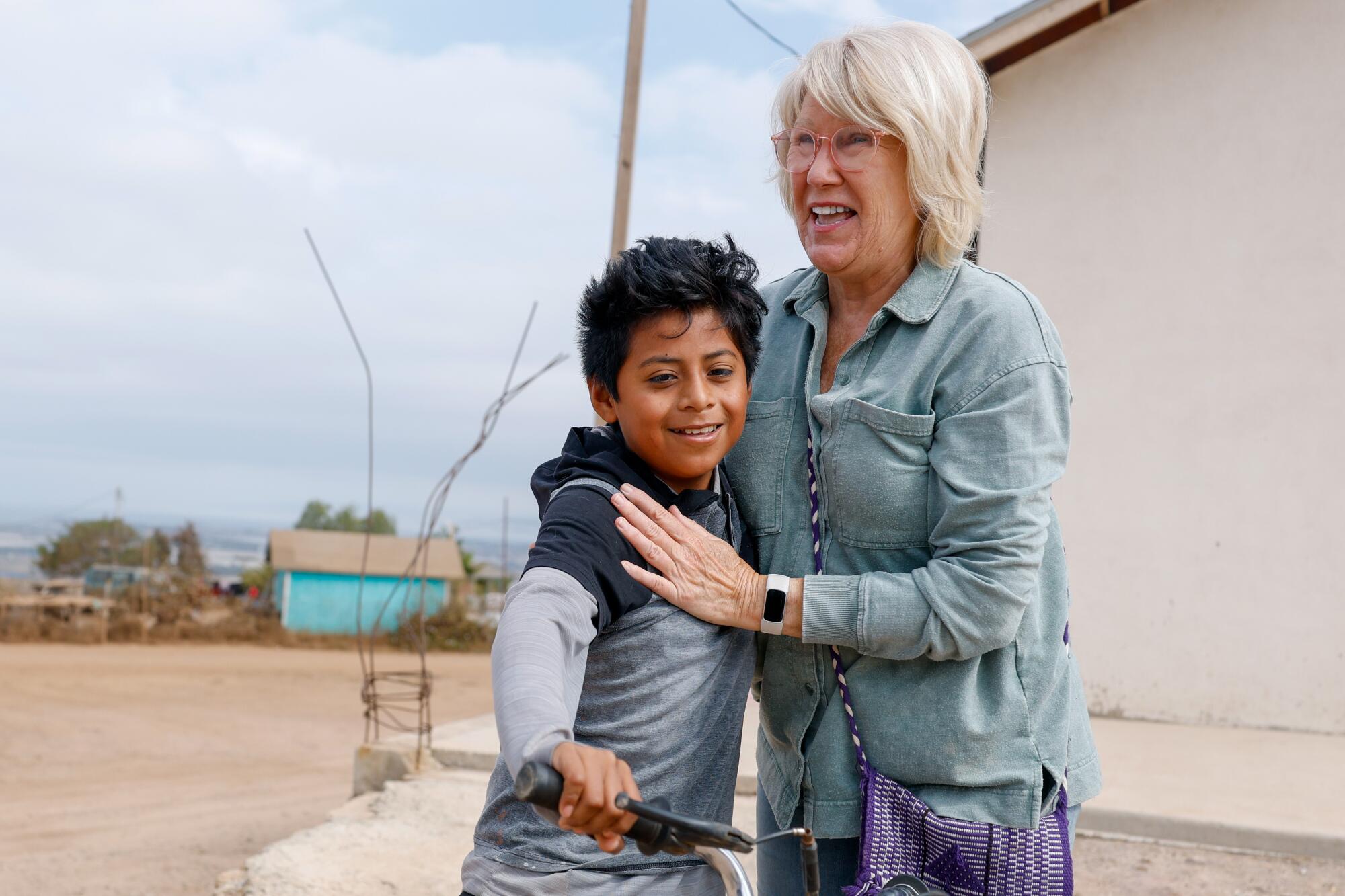 David Vasquez Garcia embraces Carol Woodruff