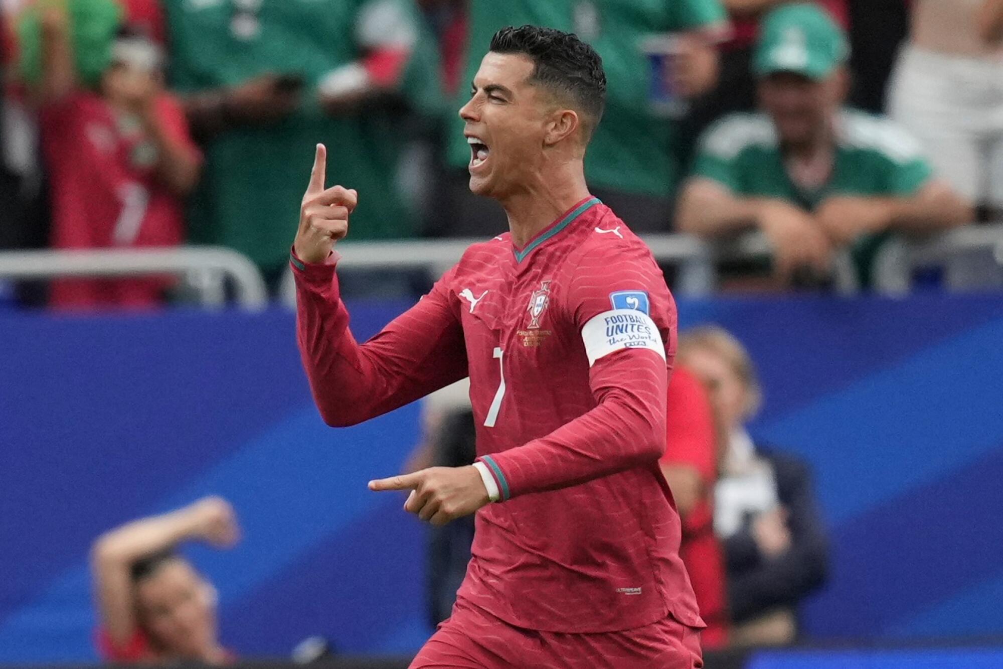 Cristiano Ronaldo celebrates after scoring for Portugal during a 5-0 win over Uzbekistan at the World Cup.