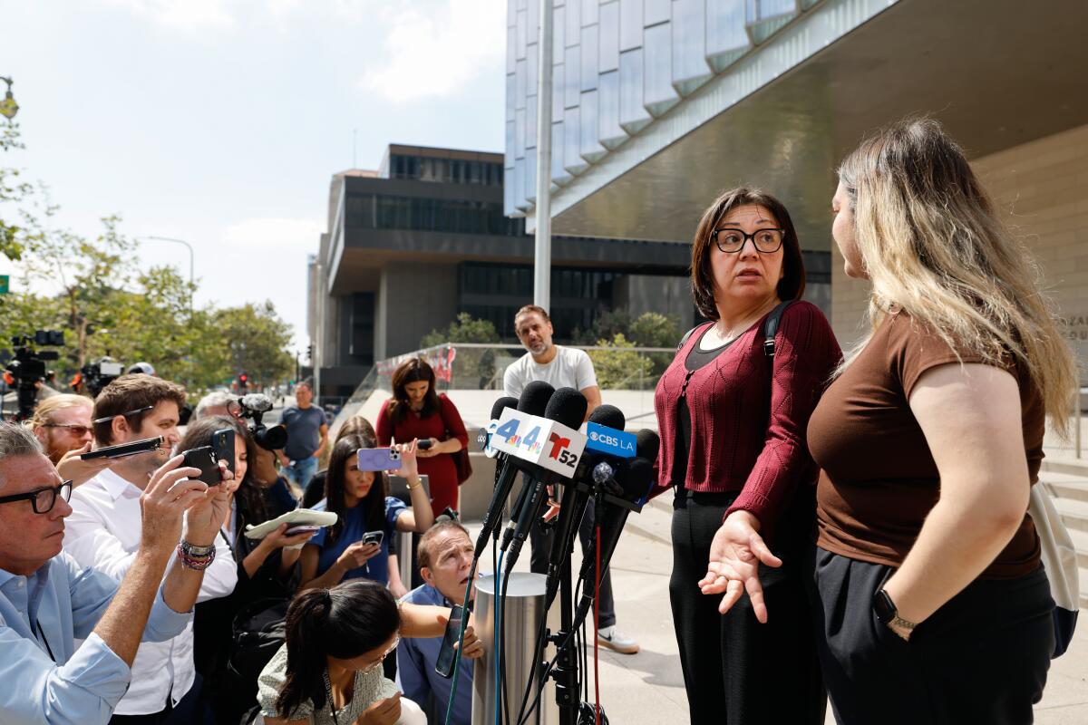  Syrena (would not provide last name), Juror 4, (left) and Briana Jimenez, an alternate juror, (right) speak to press.