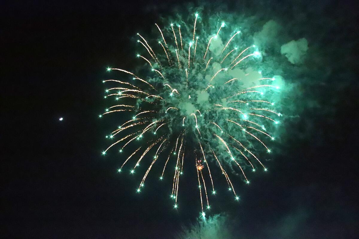 Guests watch fireworks on the Back Bay Fourth of July celebration on July 4, 2022.
