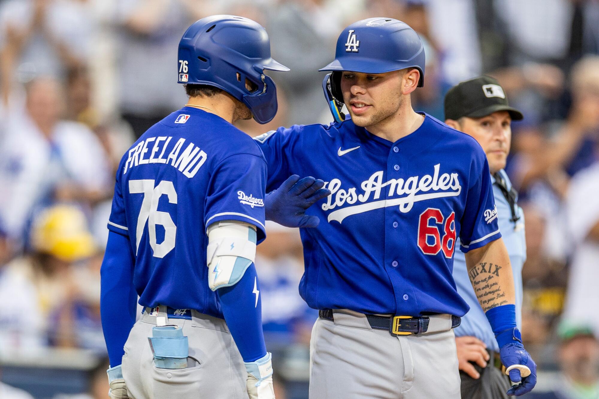 The Dodgers' Dalton Rushing celebrates with Alex Freeland after hitting a home run against the Padres Saturday.