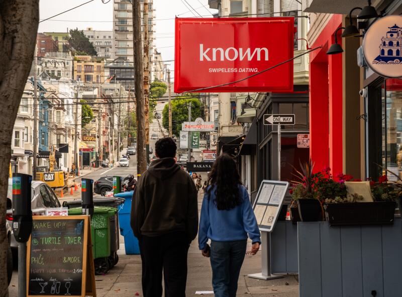 Known, an AI dating app, has their branding plastered on a store front in the Marina District San Francisco