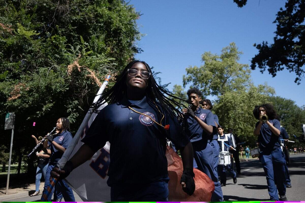 Members of the Rex and Margaret Fortune School of Education march during the parade during the Juneteenth event in Land Park on Saturday, June 20, 2026, in Sacramento.