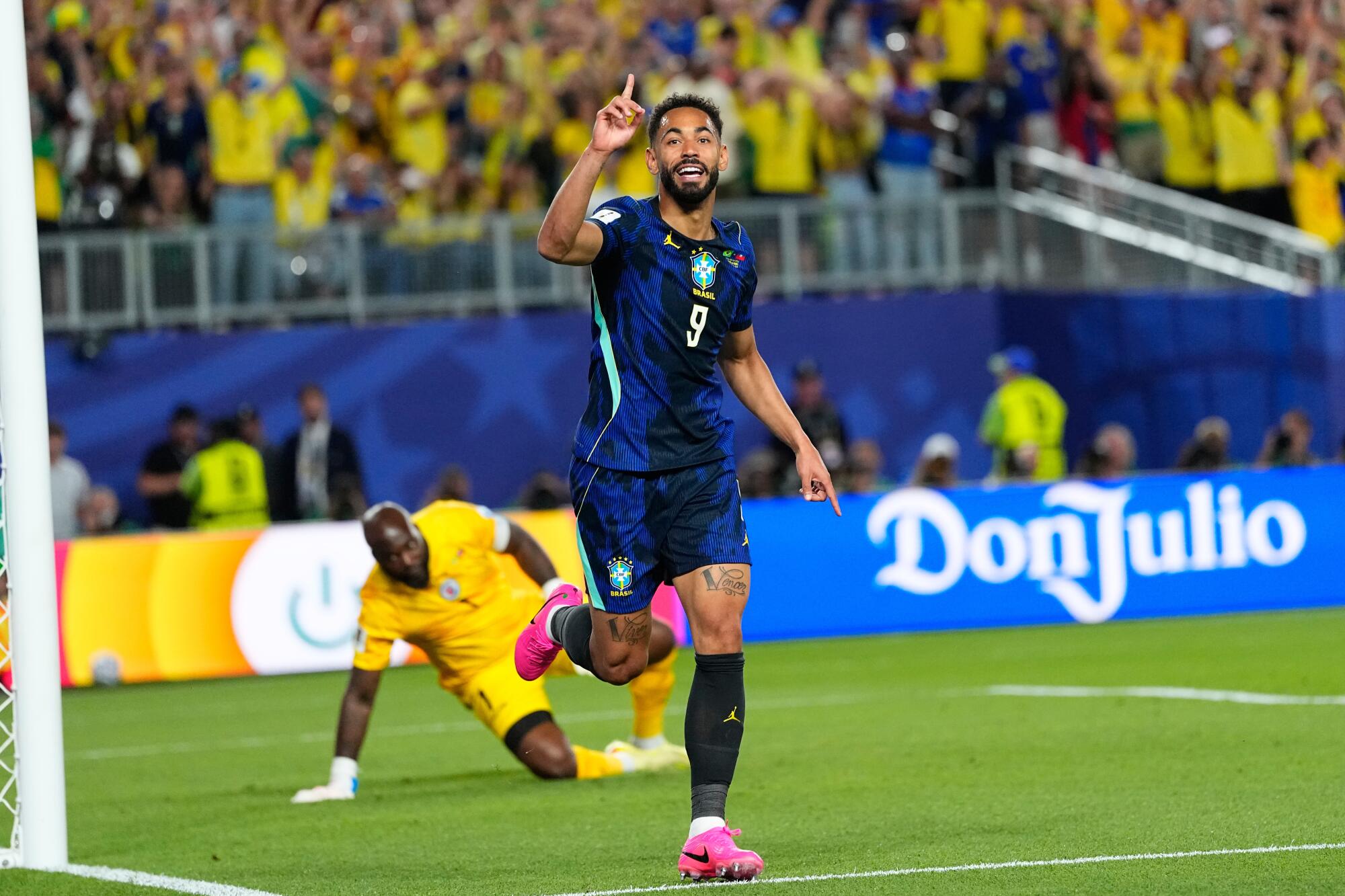Brazil's Matheus Cunha (9) celebrates after scoring his side's opening goal.