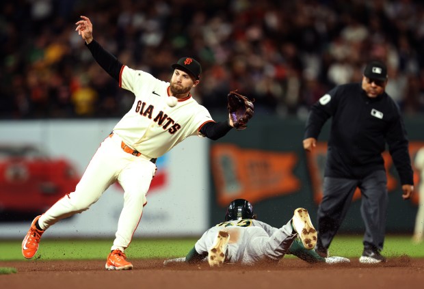 San Francisco Giants second baseman Casey Schmitt #10 takes the throw as Athletics' Henry Bolte #33 is safe on a steal in the ninth inning of their MLB game at Oracle Park in San Francisco, Calif., on Wednesday, June 24, 2026. (Jane Tyska/Bay Area News Group)
