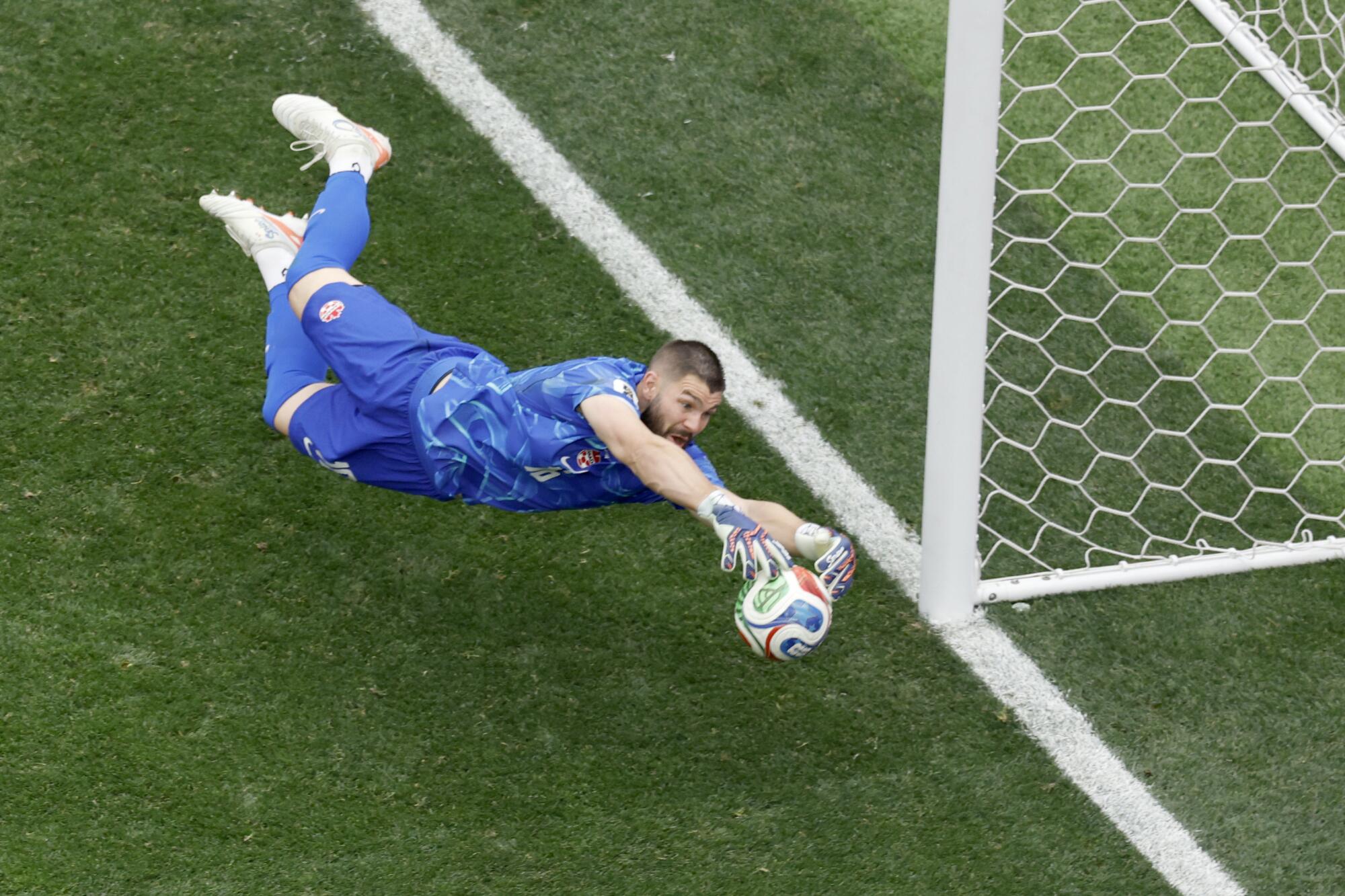 Canada goalkeeper Maxime Crepeau makes a save against South Africa on Sunday.