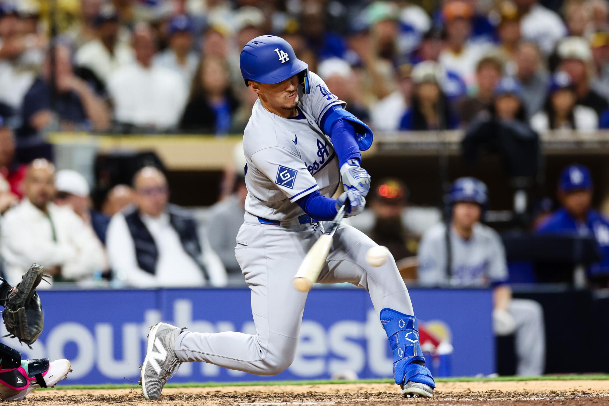 Tommy Edman hits against the San Diego Padres on Friday.