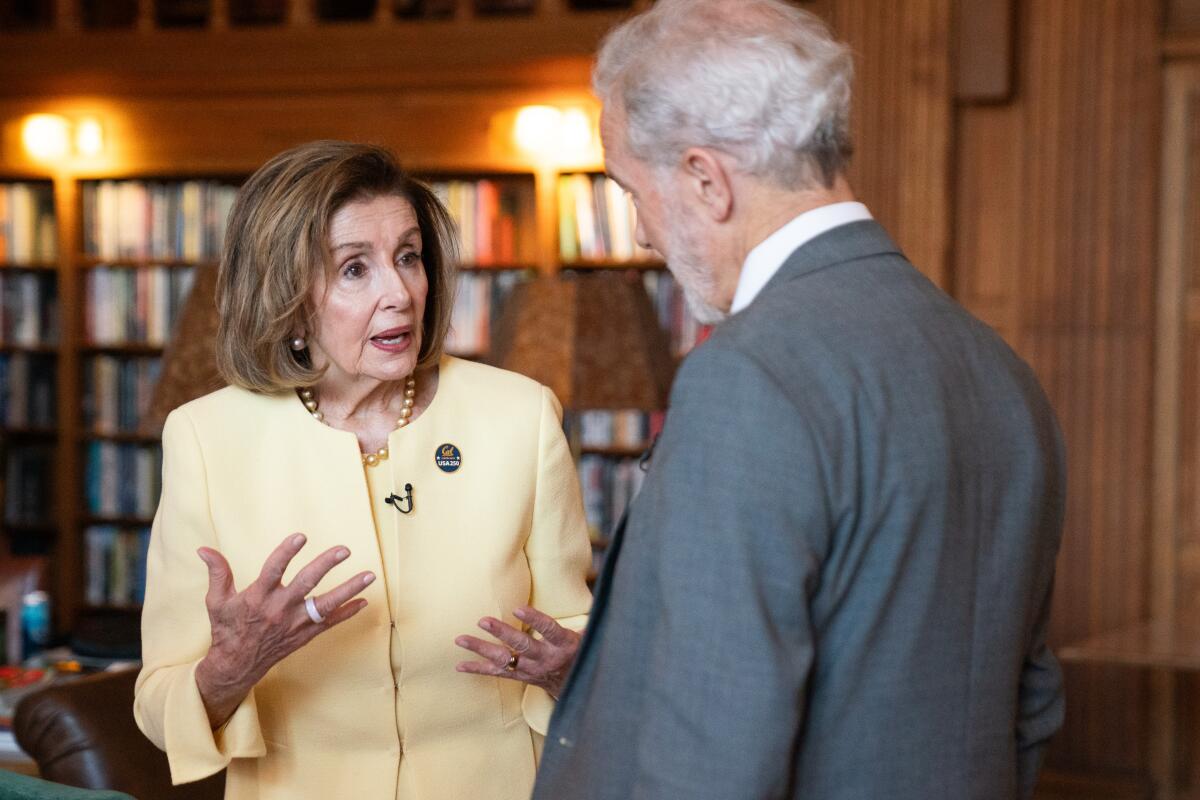 Rep. Nancy Pelosi talks with UC Berkeley Chancellor Rich Lyons.