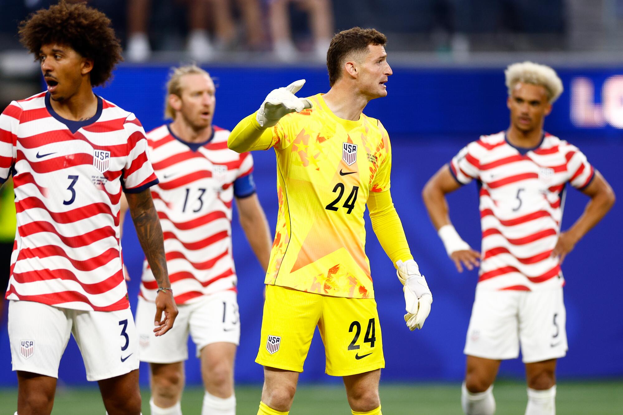 U.S. goalkeeper Matt Freese directs his teammates before Paraguay takes a free kick during a World Cup match.