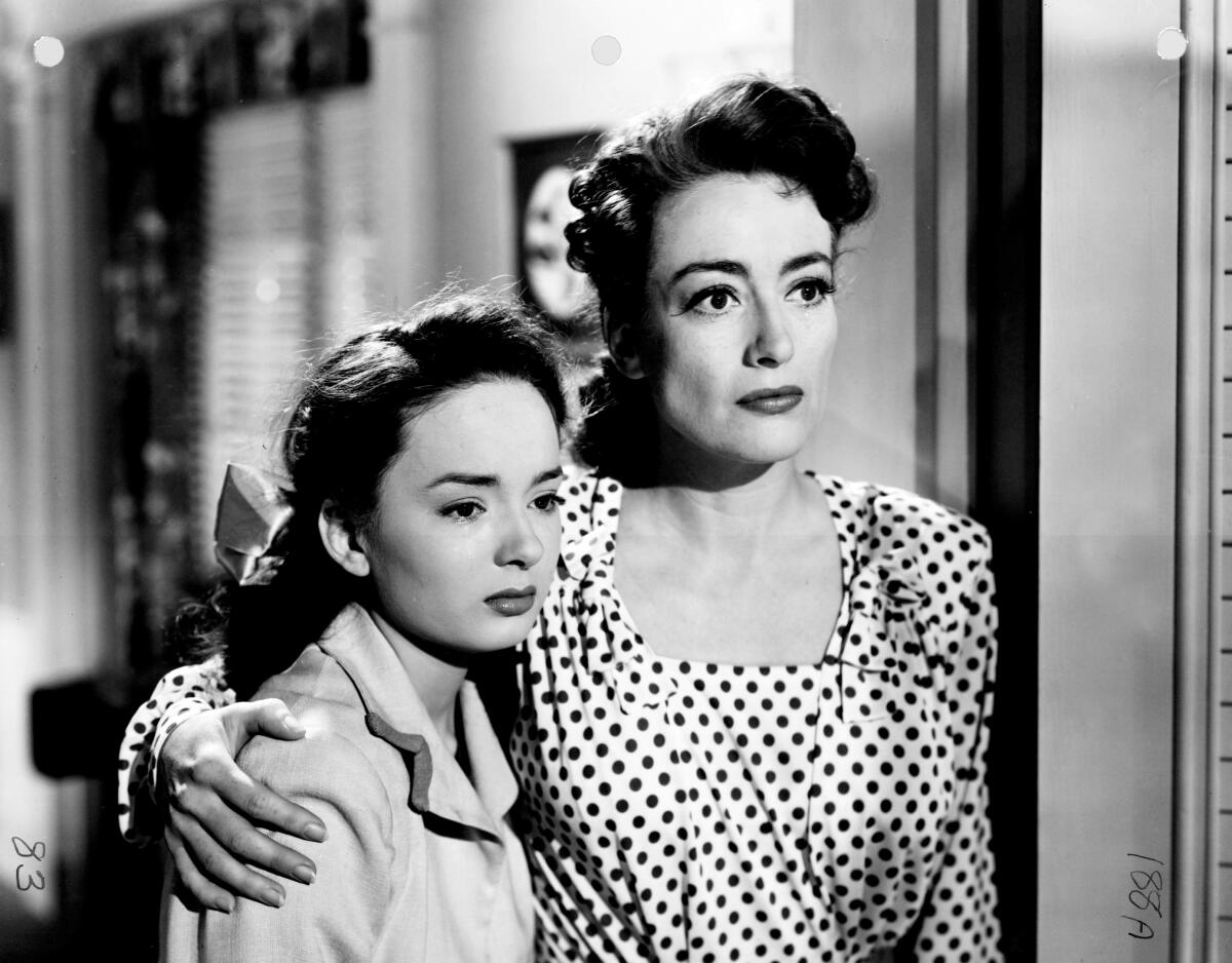 Ann Blyth as Veda and Joan Crawford as Mildred.