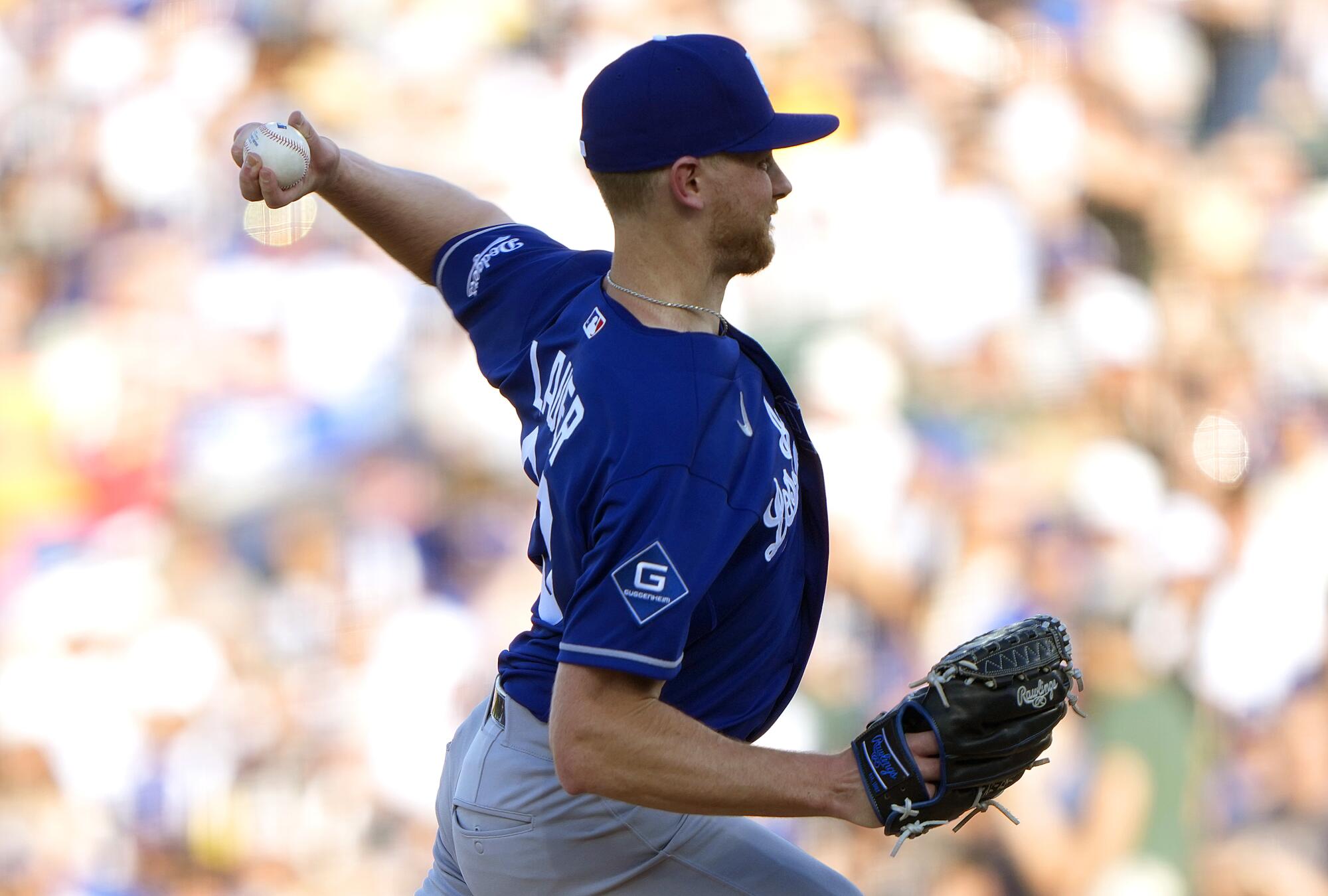 A left-hander pitches.