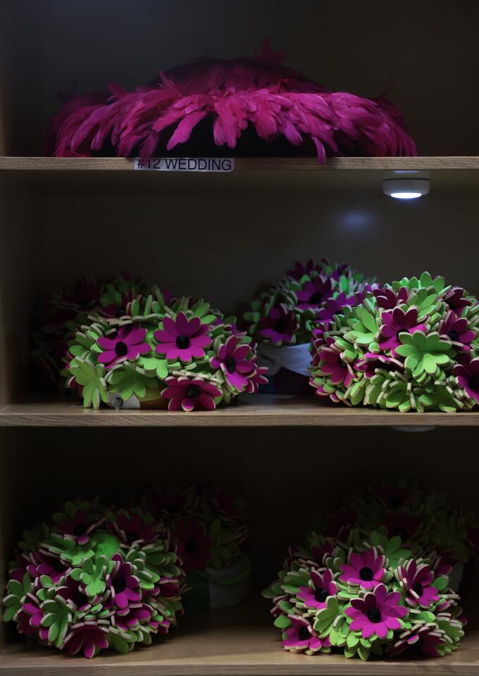 Shelves full of hats are seen during a backstage tour.