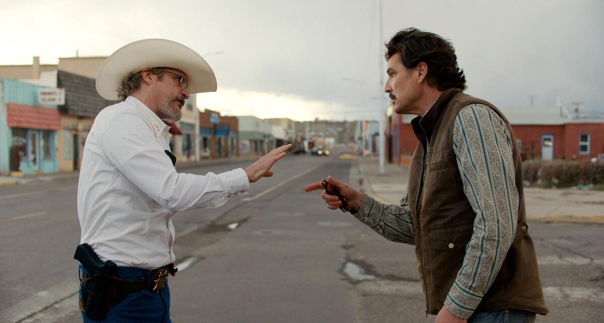 Joaquin Phoenix, left, and Pedro Pascal in "Eddington," which was filmed in Truth or Consequences, N.M.