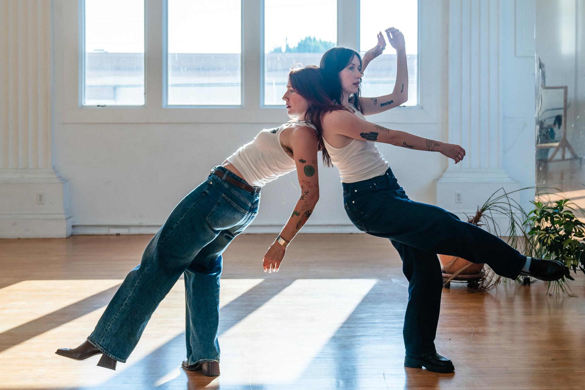 Lena Martin leans against Mandolin Burns as they dance. 