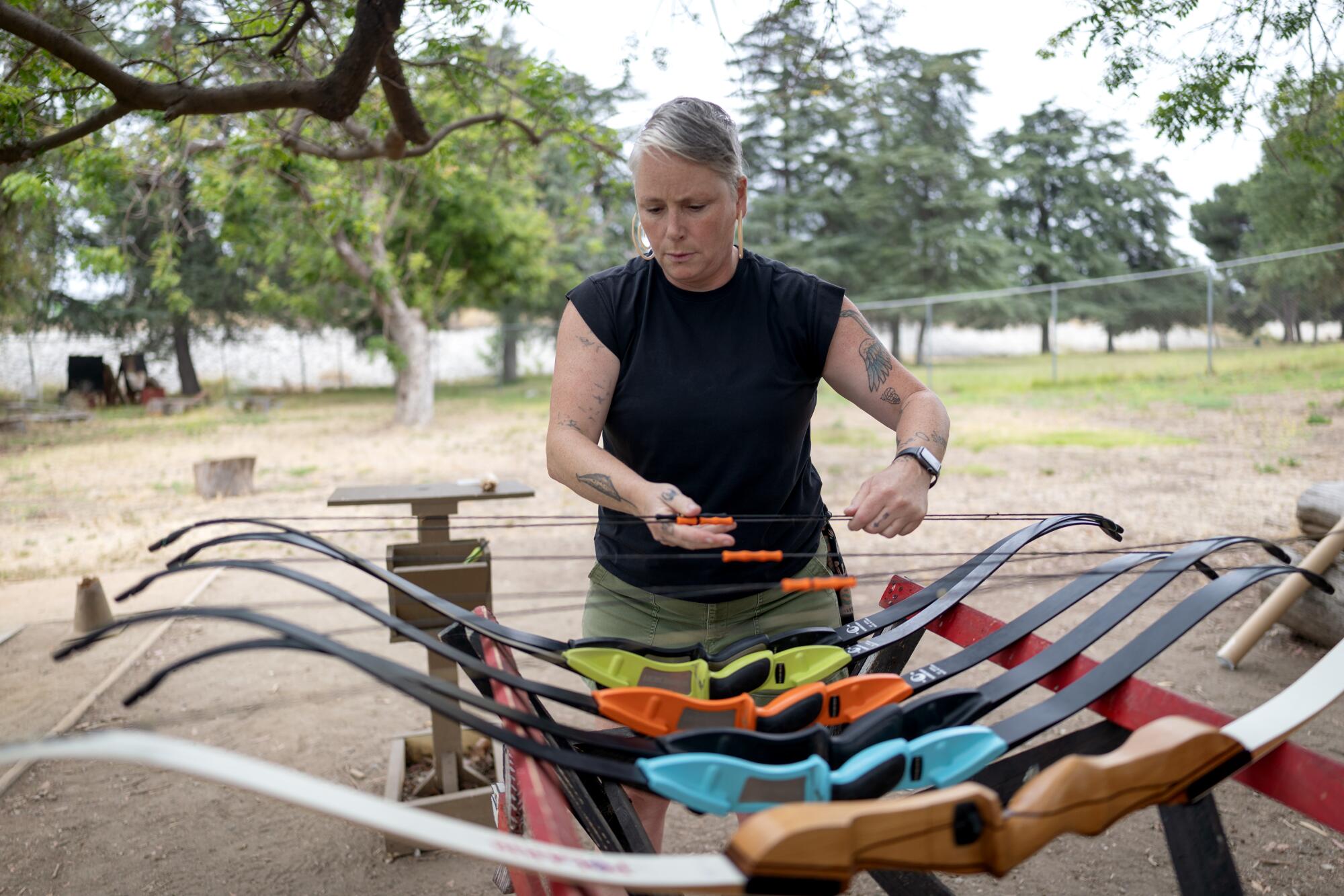 Angie Fadel readies bows.
