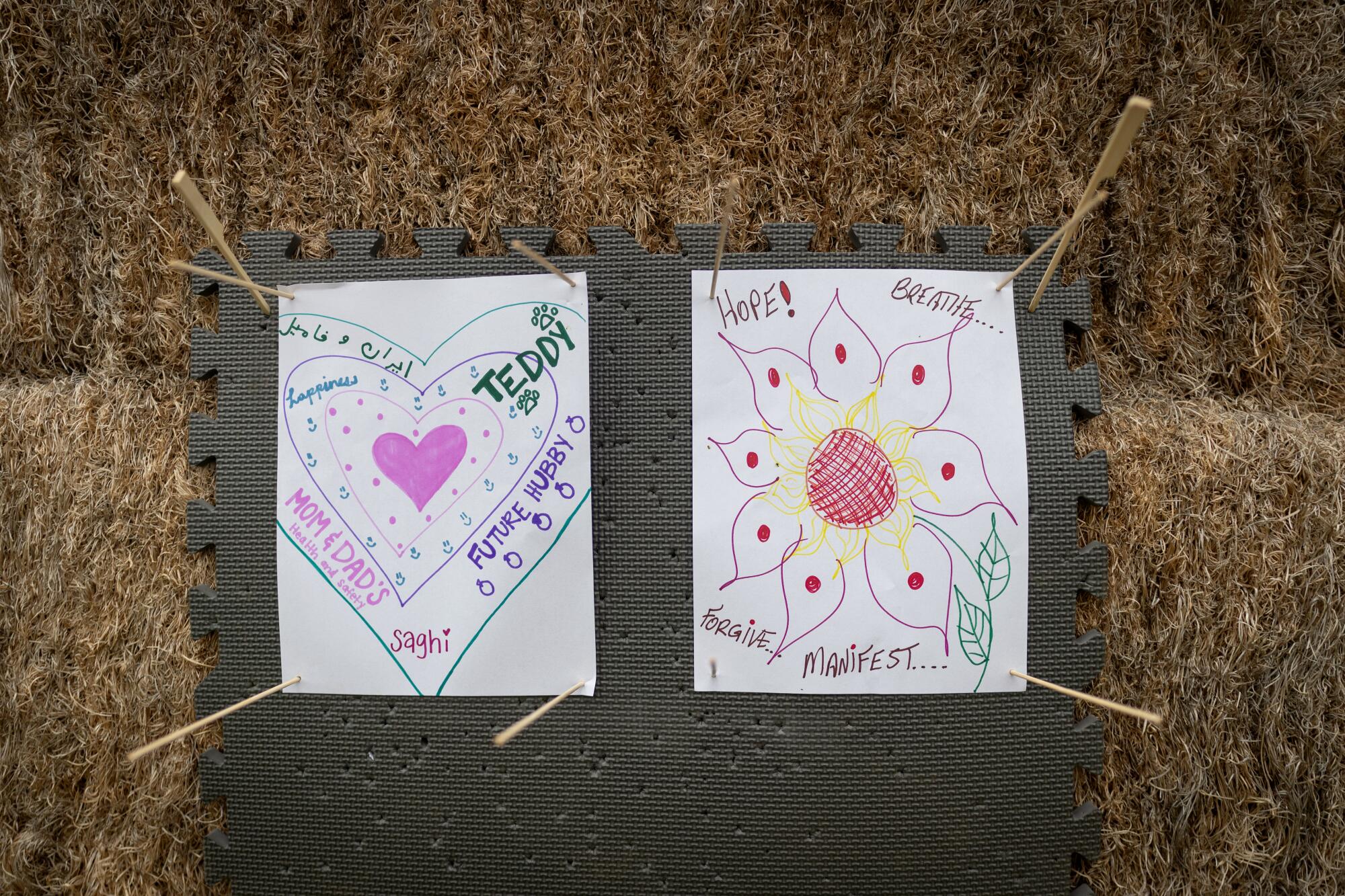 Targets pinned to a hay bale allow participants to take aim at what they want to bring into their lives.