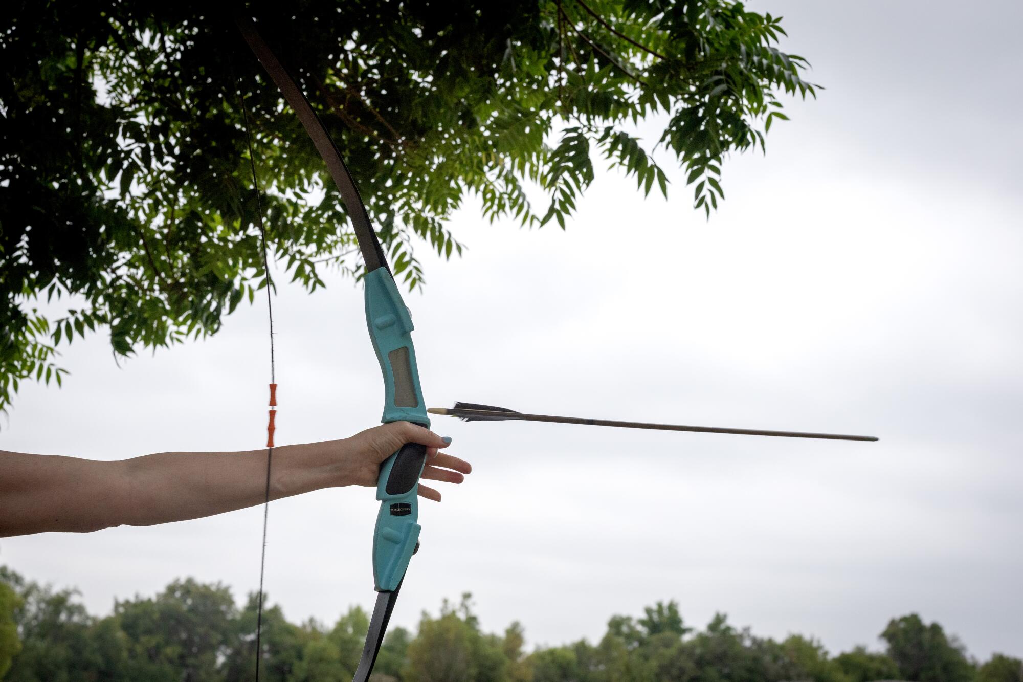 Archery is about "letting go" and here, a student lets her arrow fly.