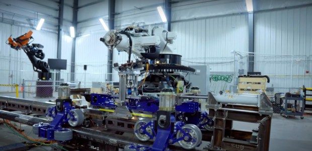 Stark Flight Lab robot arms in a still frame from a Walt Disney Imagineering video posted to YouTube. (Courtesy of Disney)