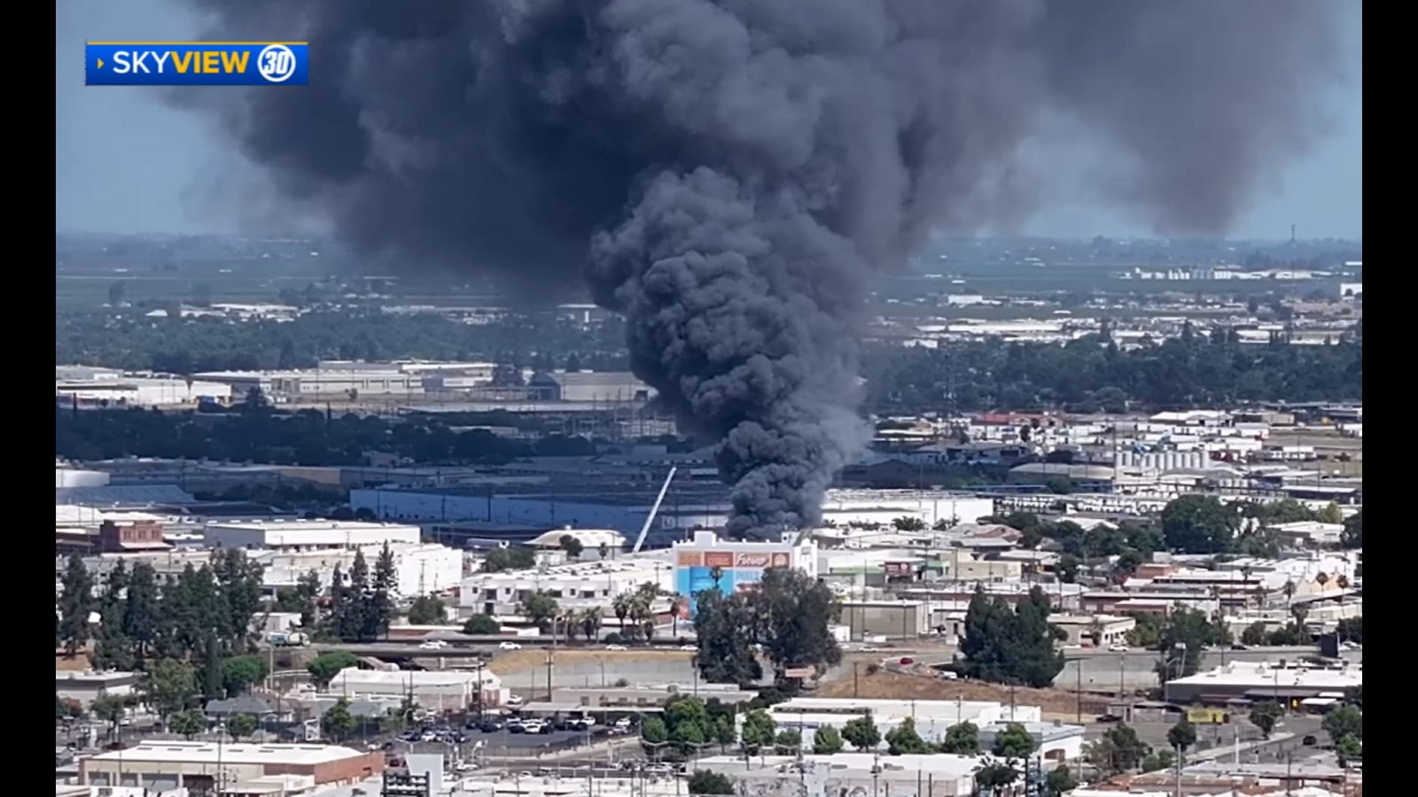 Large warehouse fire erupts in Southeast Fresno