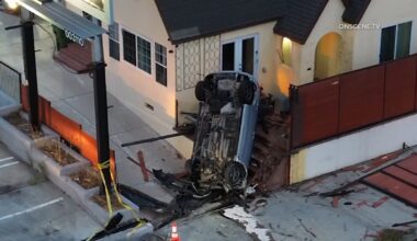 Driver crashes into Wilmington home, flipping vehicle and leaving it standing upright