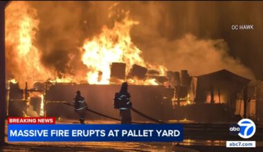 Massive fire erupts at pallet yard in Orange