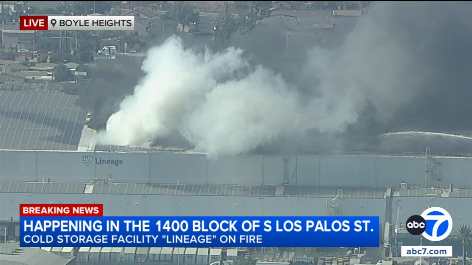 Drivers react to large building fire burning in Boyle Heights