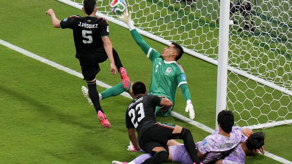Mexico goalkeeper Raul Rangel, middle, reaches to stop the ball during the World Cup Group A soccer match between Mexico and South Korea in Zapopan, near Guadalajara, Mexico, Thursday, June 18, 2026. (AP Photo/Silvia Izquierdo)