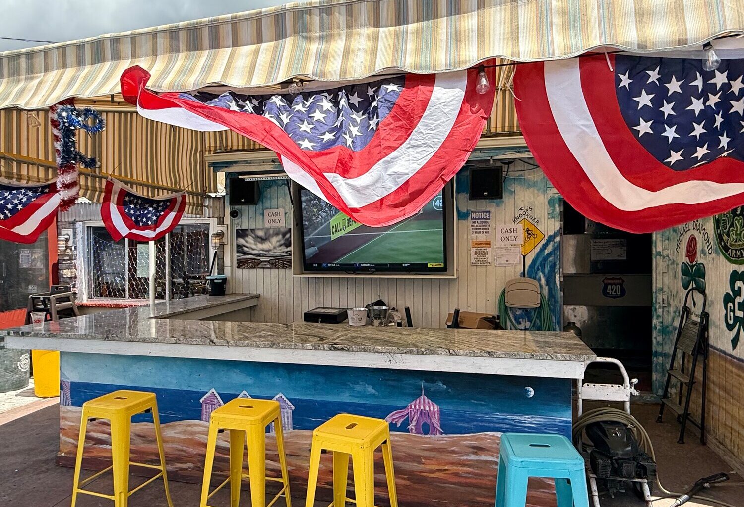 The outside bar at Cabana has the largest TV at the establishment. There are also six other TVs inside.