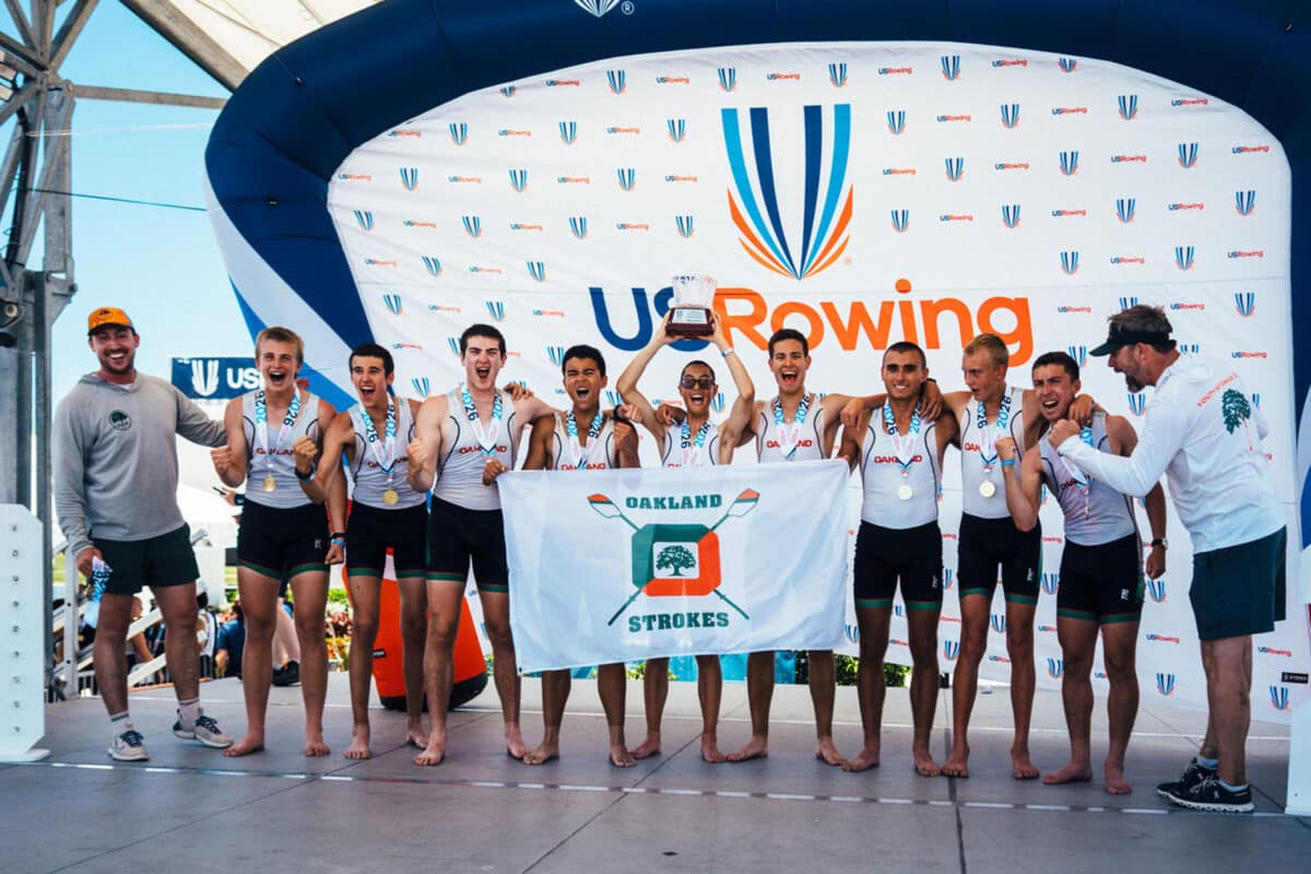 Alameda Post - The Oakland Strokes men's team smiles with a trophy and medals. 